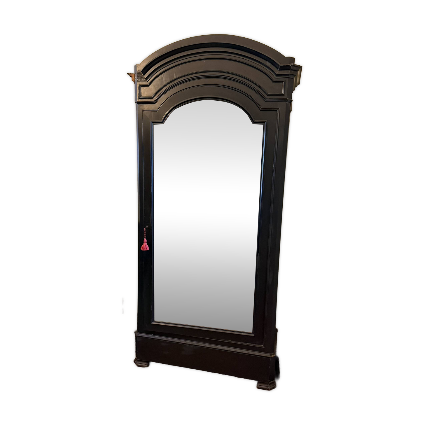 Black wardrobe with a mirrored door in ebony finish.
