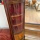 Corner display case in wood veneer with musical instrument marquetry
