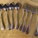 Series of 4 silver metal cutlery uniplat net model spoons forks