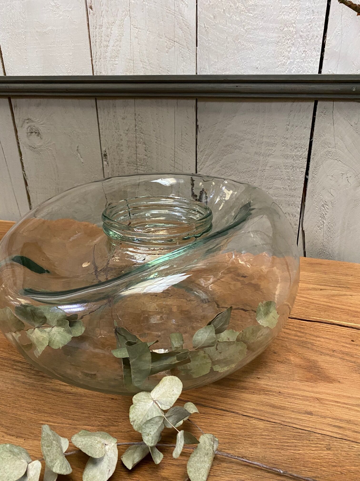 Old jar made of deformed glass