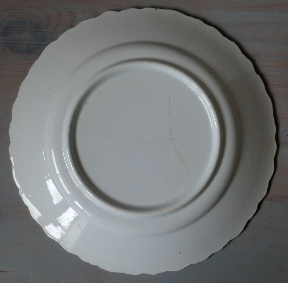 Antique earthenware plate with cherry blossom decoration