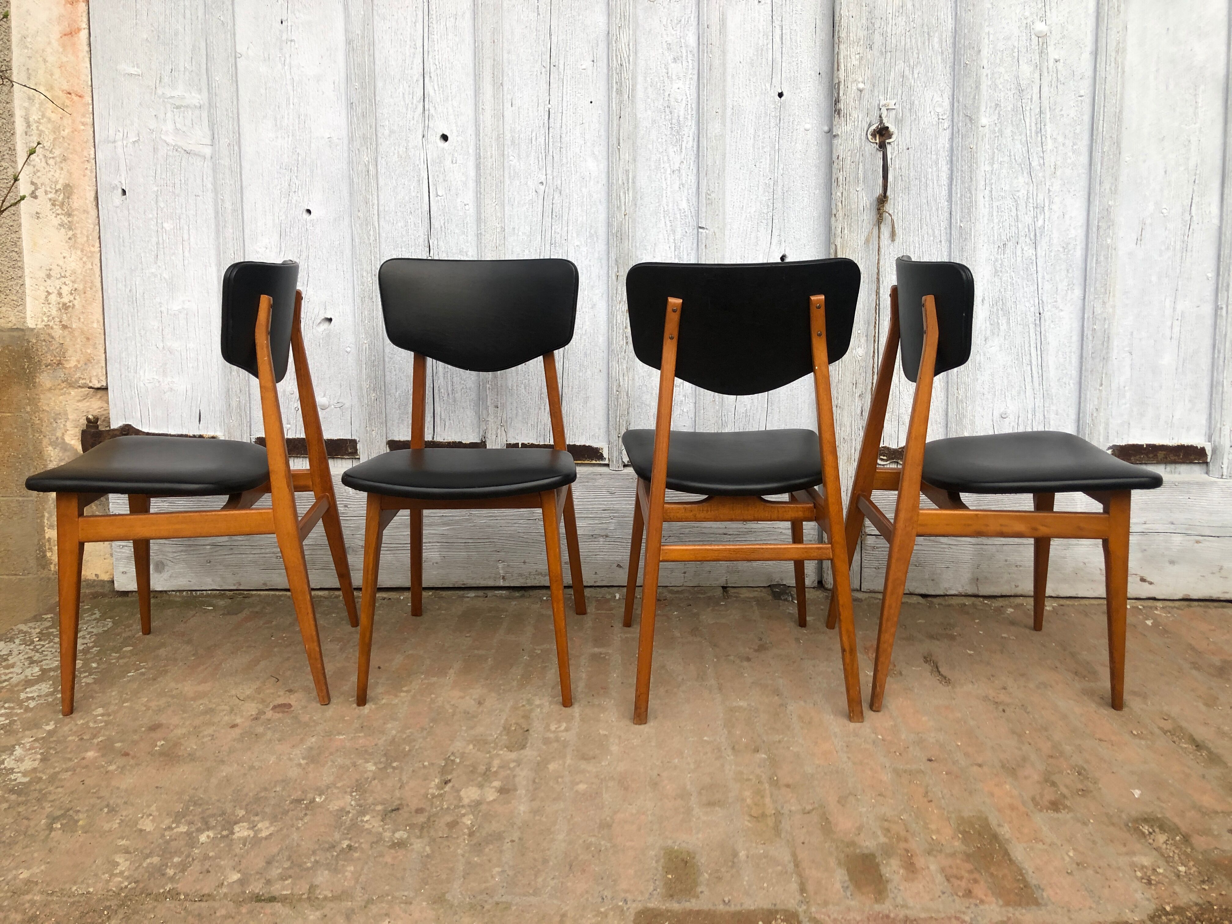 Set of 4 Scandinavian teak and black skai chairs