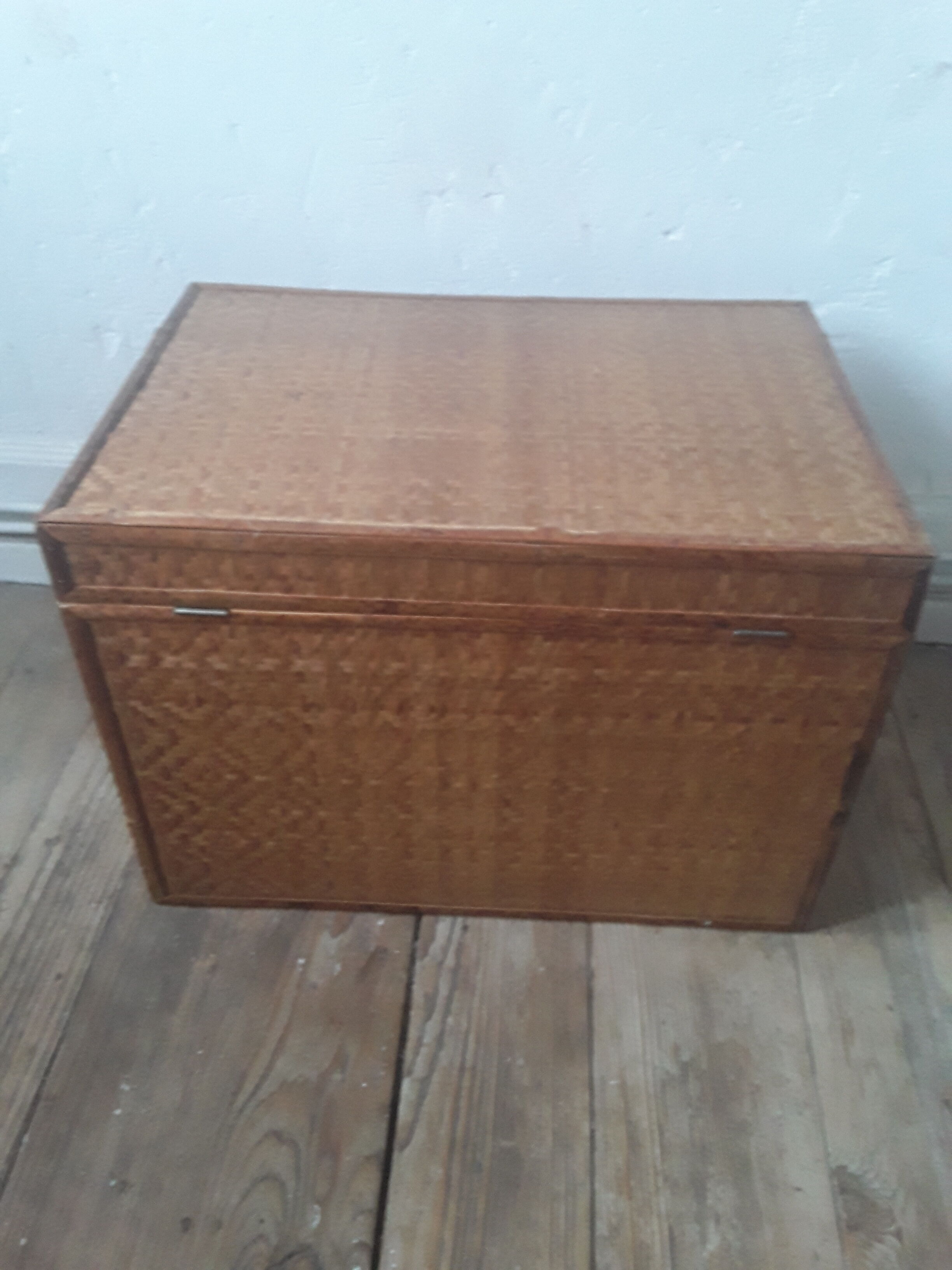 Wooden trunk with braiding