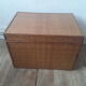Wooden trunk with braiding