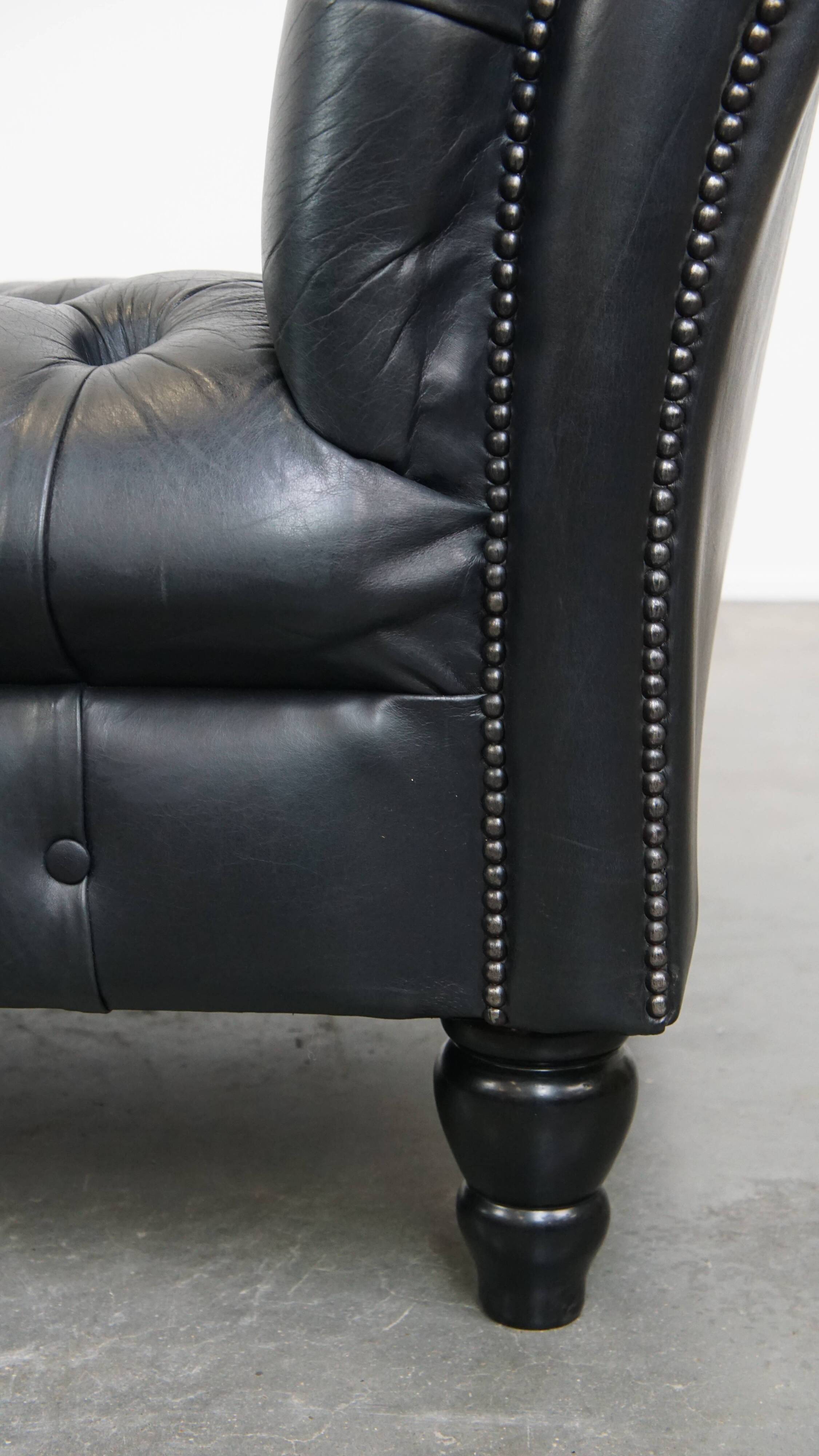 Black chesterfield daybed made of cowhide