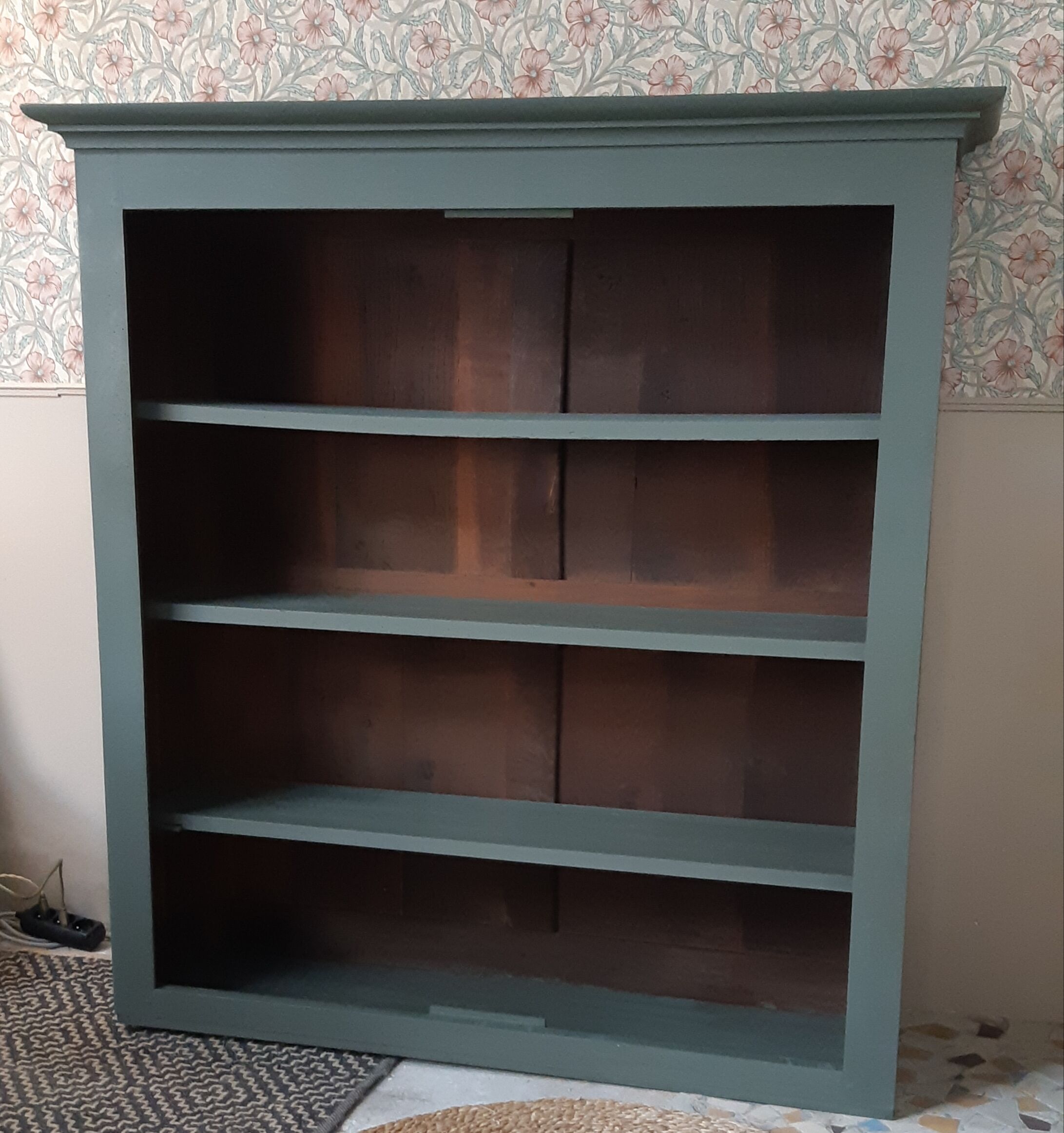 Wood and khaki green bookcase