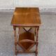 Wooden side table magazine rack in neo-classical English style.