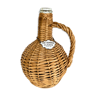 Rattan bottle and medallion