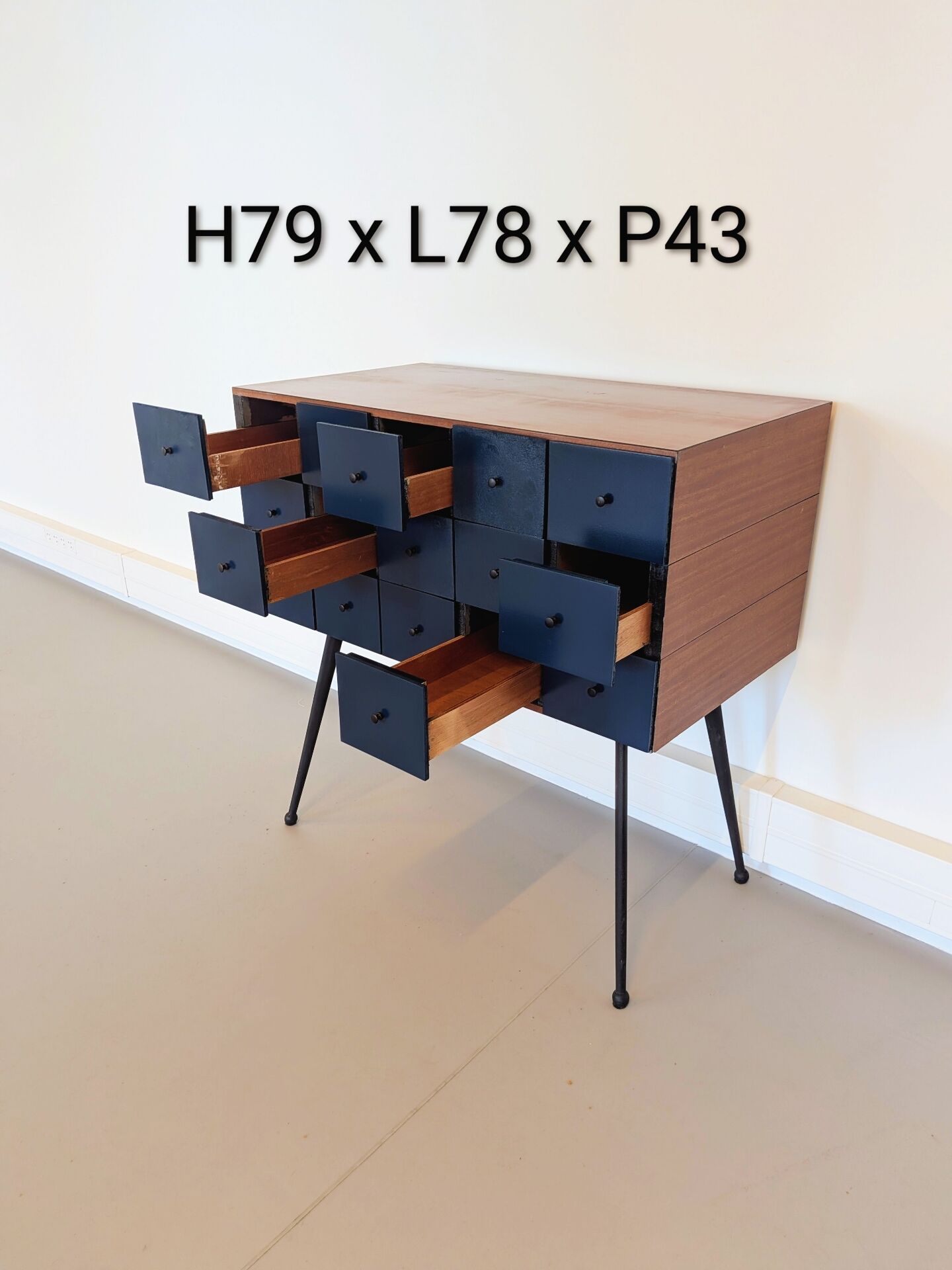 Vintage workshop furniture with 15 blue drawers.