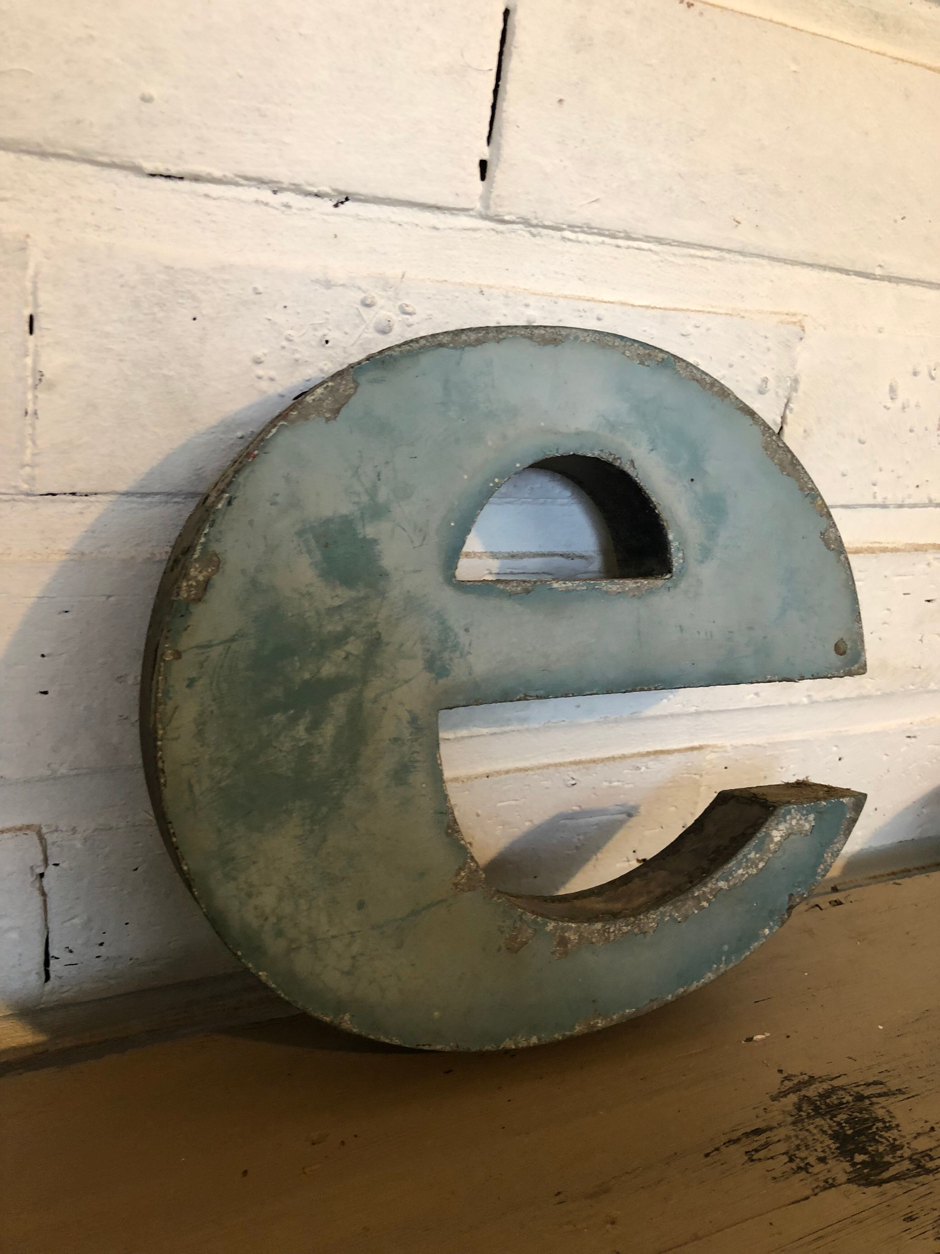 Blue sign letter "E"