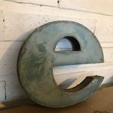 Blue sign letter "E"