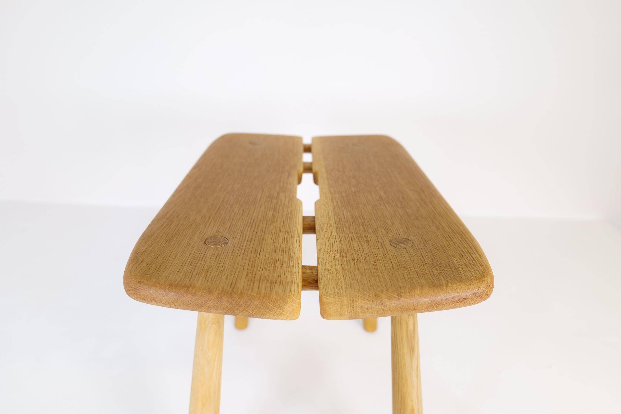 Sculptural mid-century stool in solid oak by Carl Gustaf Boulogner, Sweden, 1950s.