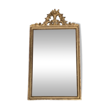 Antique mirror in wood and gilded stucco with a pediment - in the style of the 18th century.