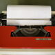 Red and white SVM 315 typewriter