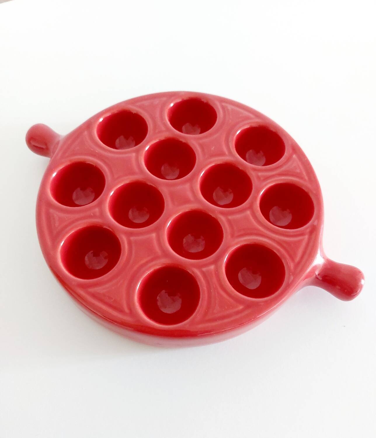 Red ceramic snail dishes