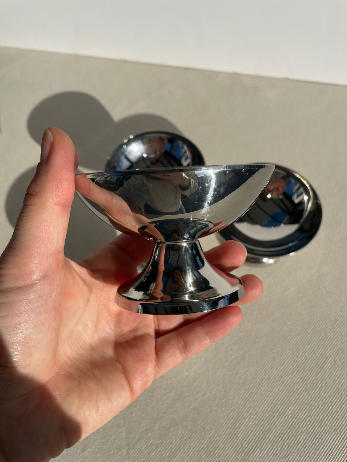 Set of 4 metal glasses / vintage stainless steel ice cream cups on a stand.