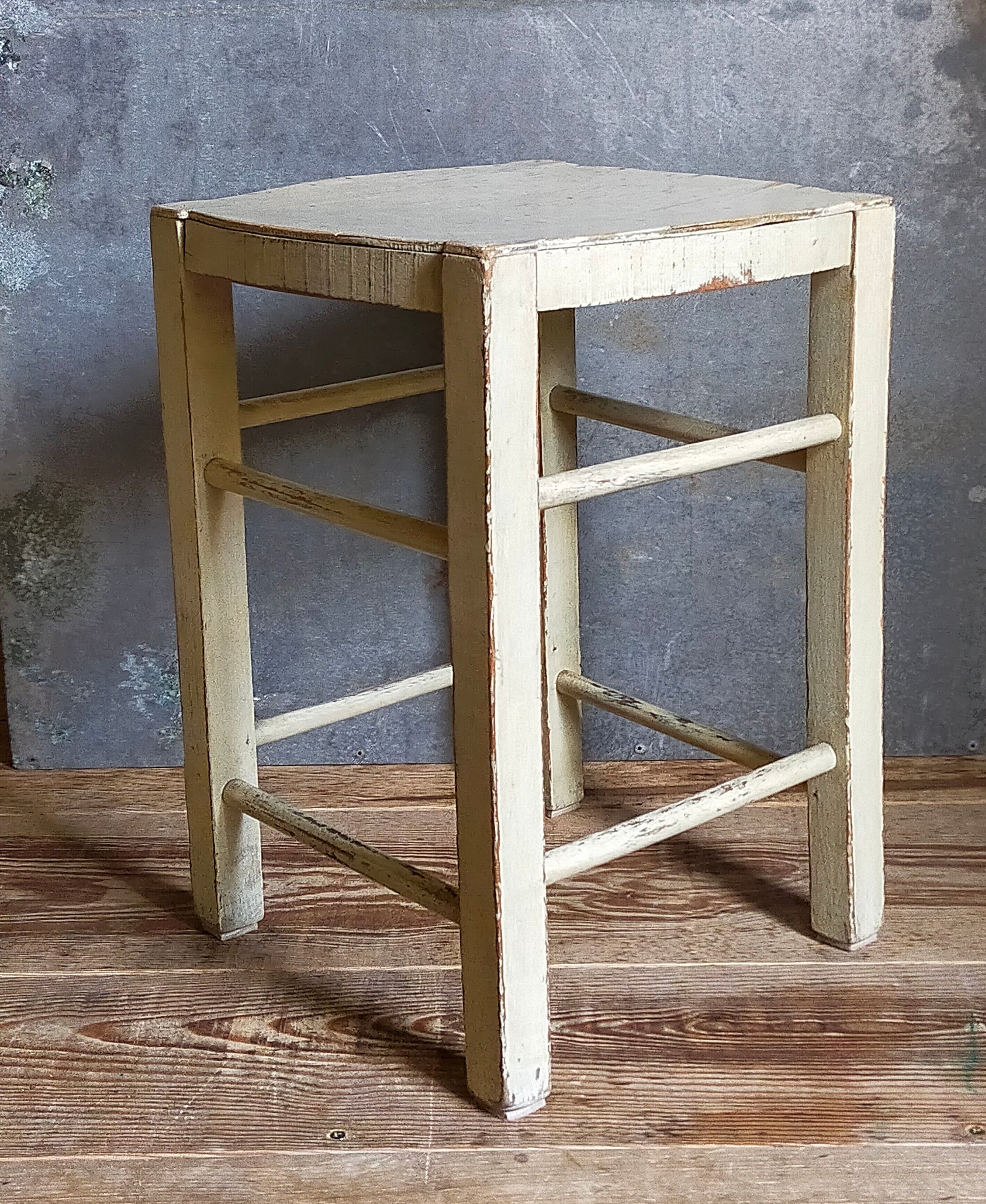 Old patinated painted wooden stool