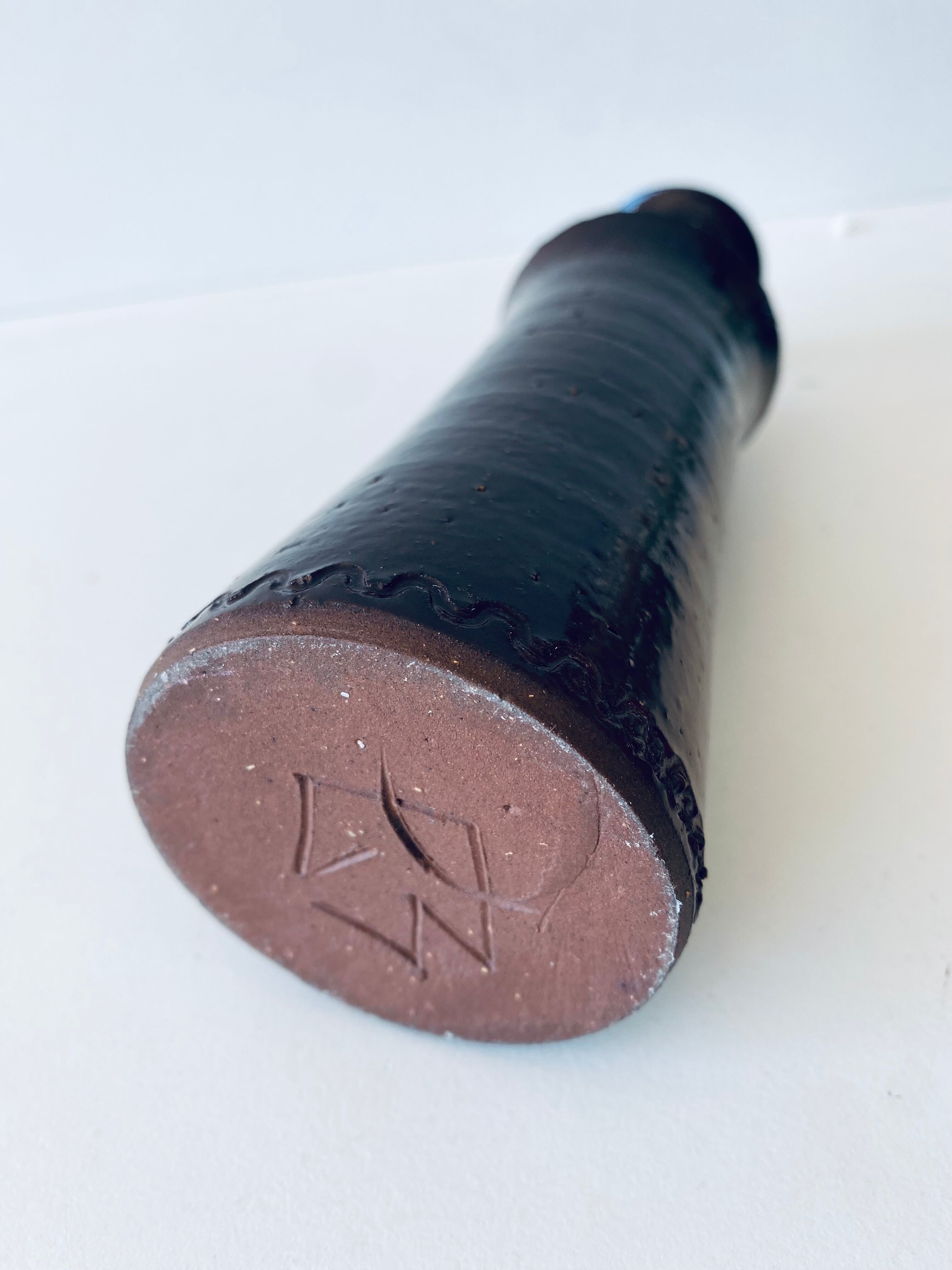 Tubular vase in glazed brown sandstone