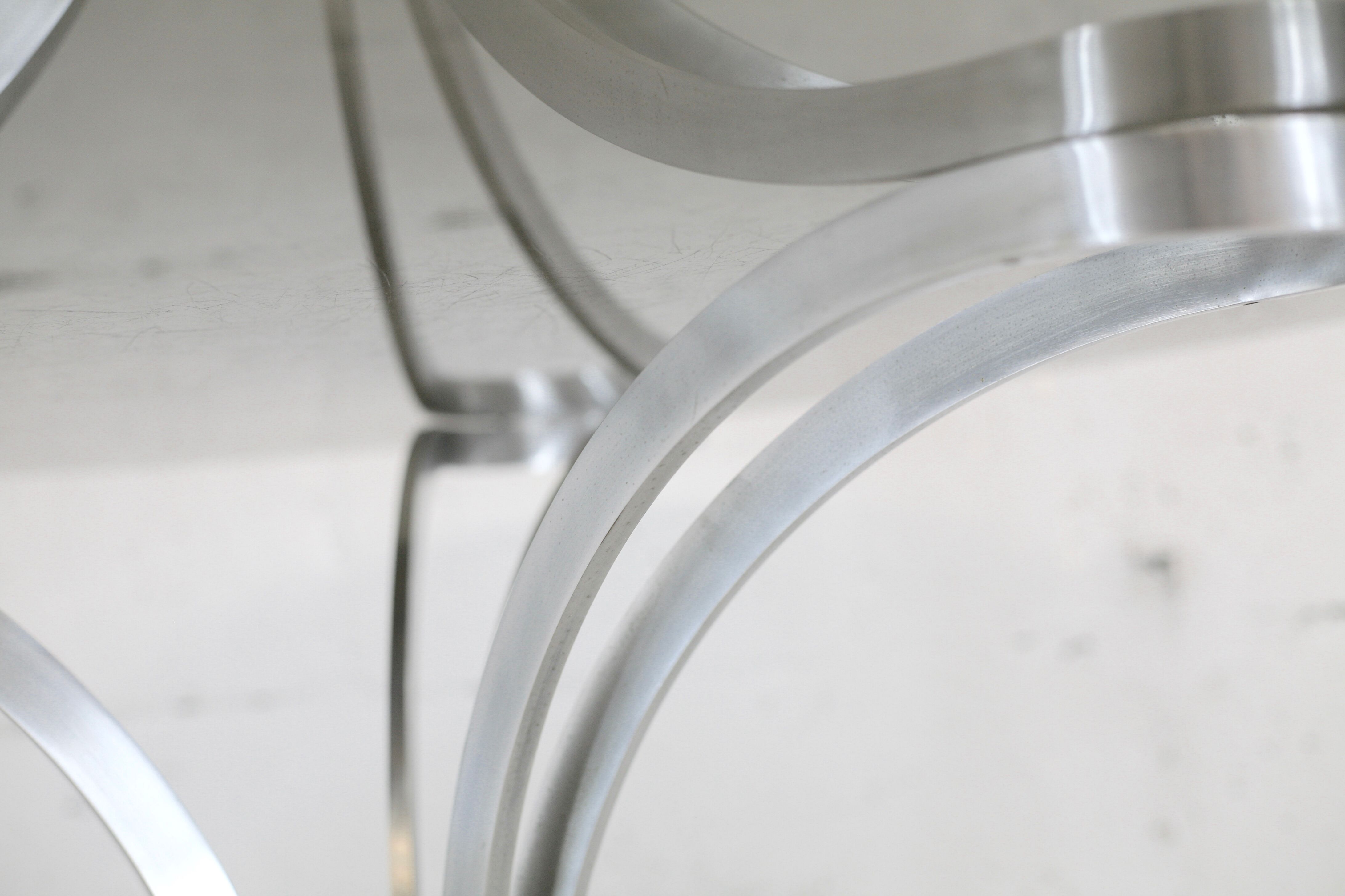 Living room table "Space Age" polished steel, circular slab smoked glass. France, circa 1970.