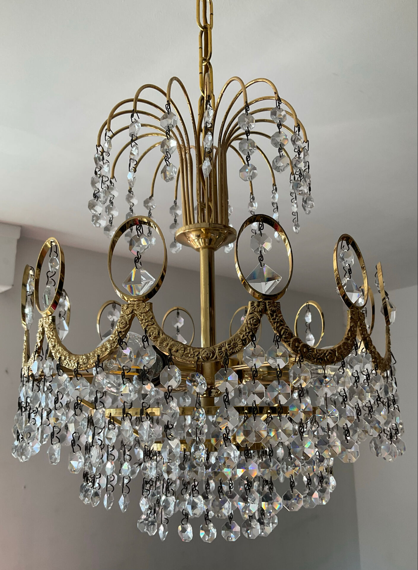 Brass chandelier with crystal pendants from the 1970s.