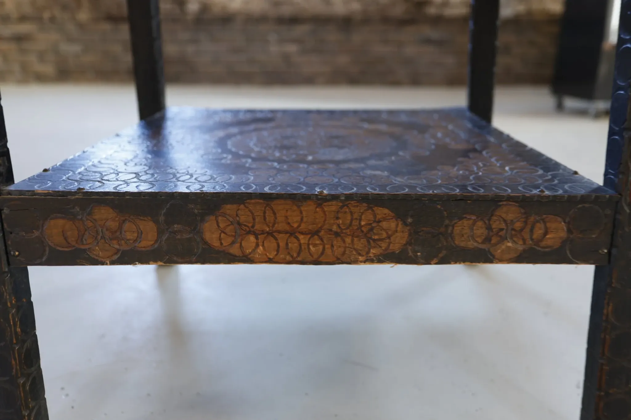 Decorated antique side table with elephant