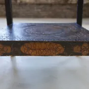 Decorated antique side table with elephant