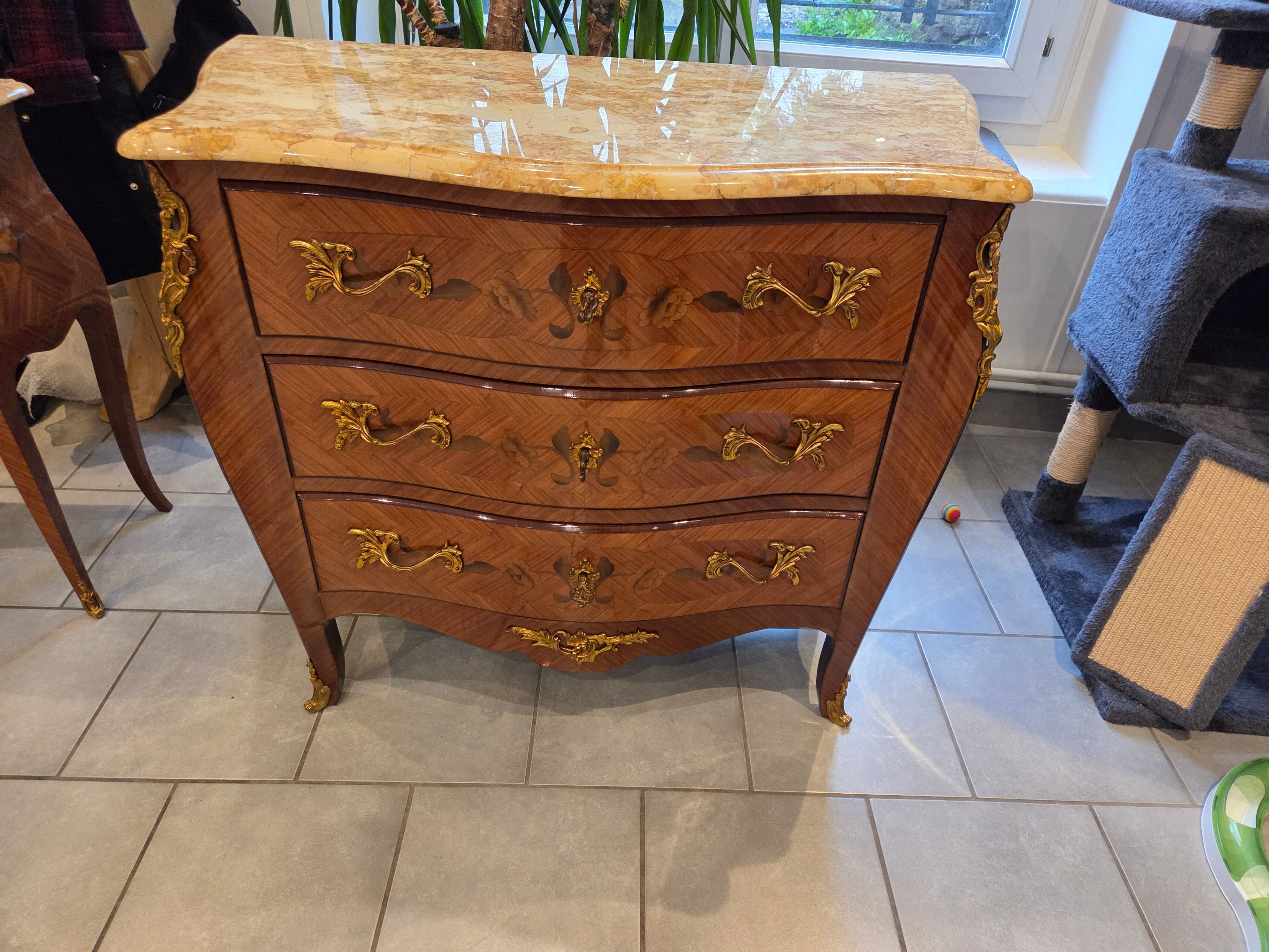Louis XV style commode with marquetry and marble.