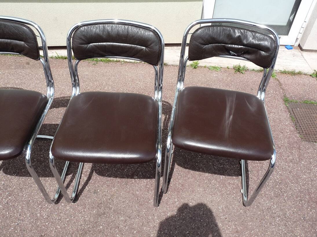 Set of 4 chrome metal and vintage leather chairs