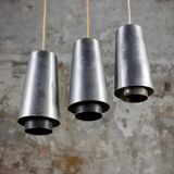 Trio of Raak steel pendant lights, 1960s