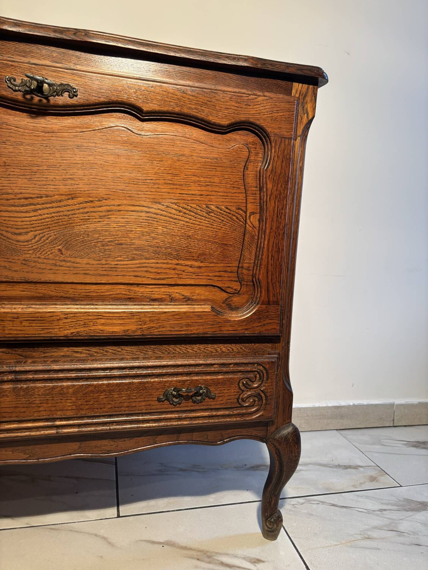 Louis XV style oak TV cabinet with drop-down flap.
