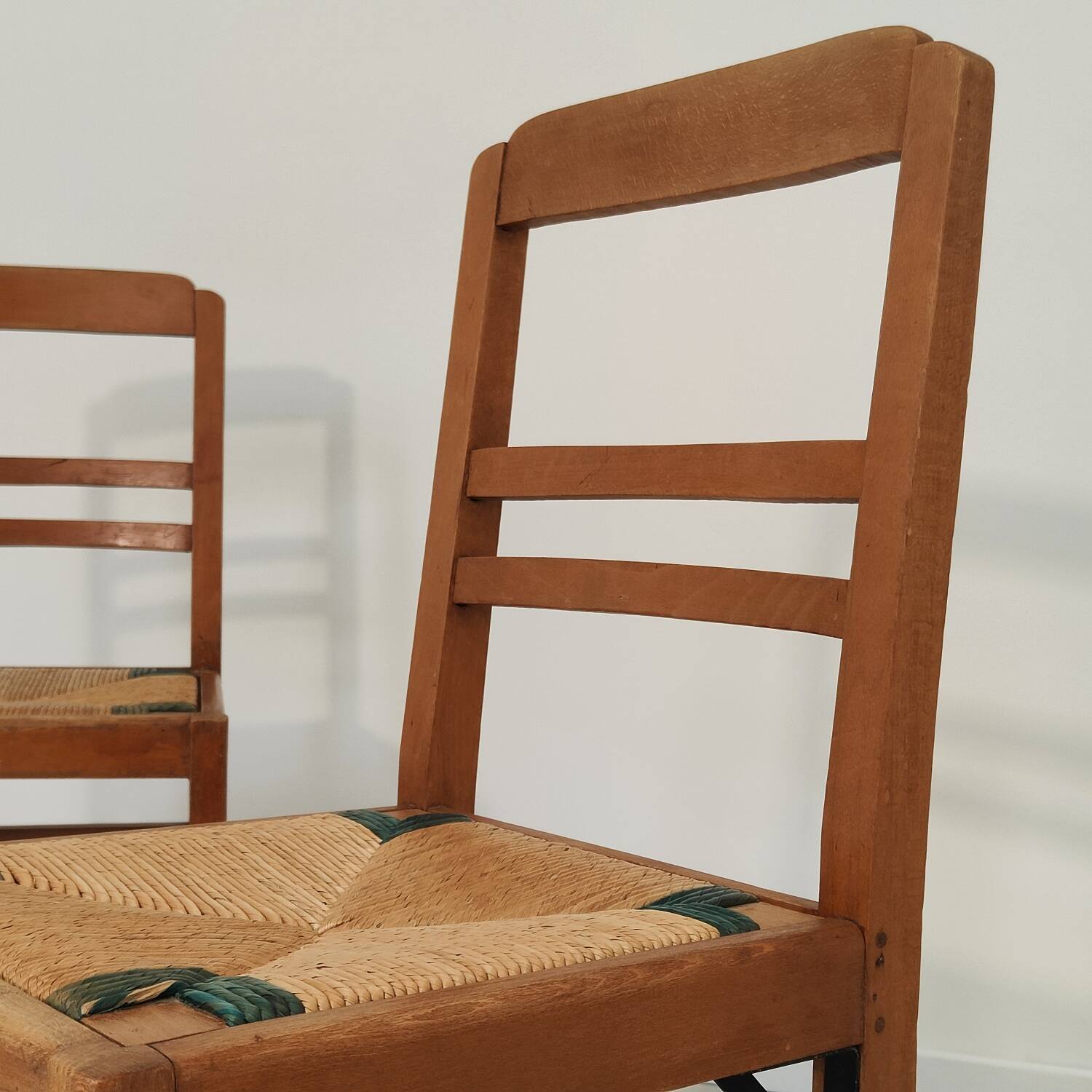 Set of 4 designer oak and straw chairs from the 1950s