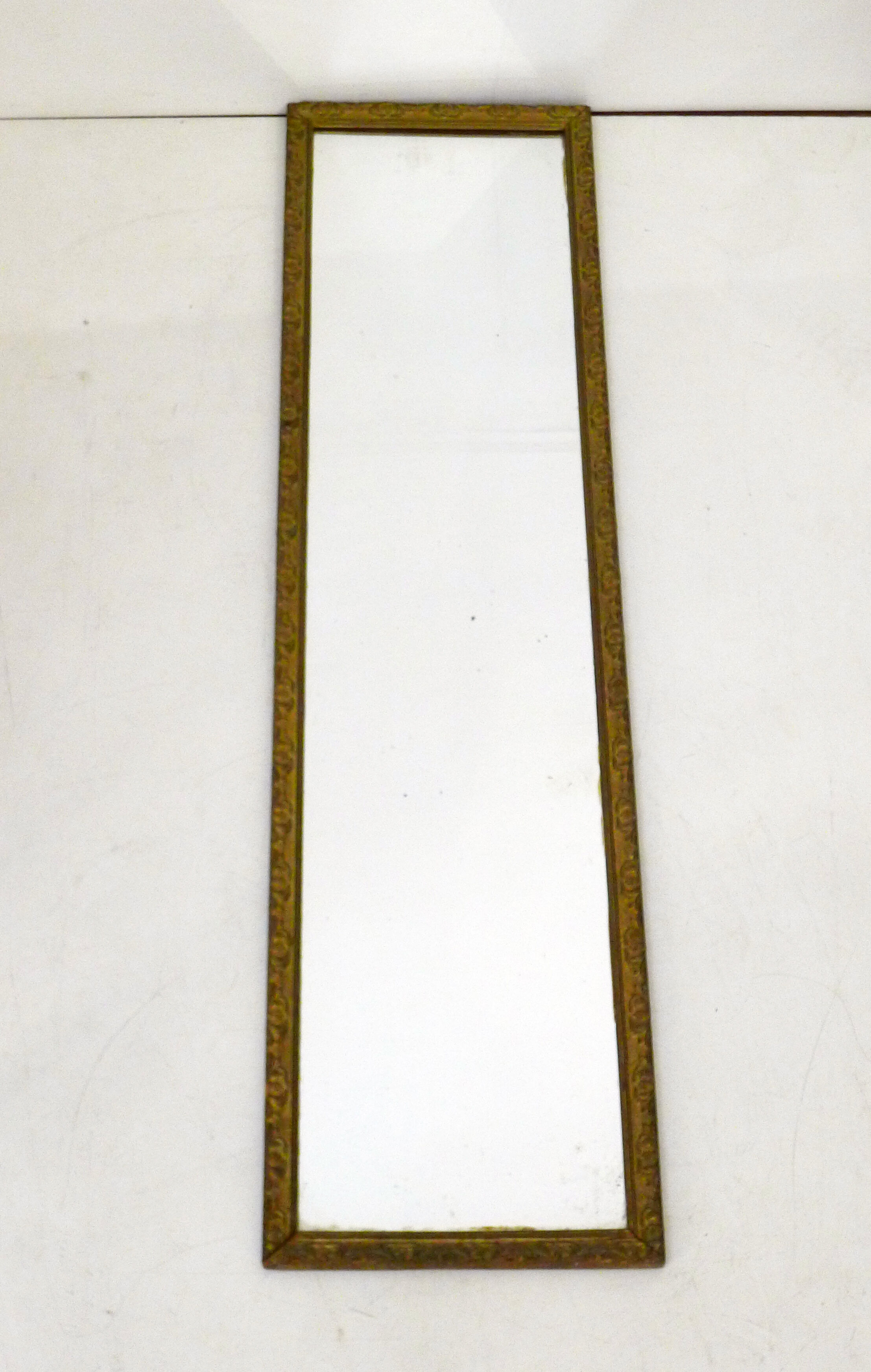 Large elongated gilded mirror