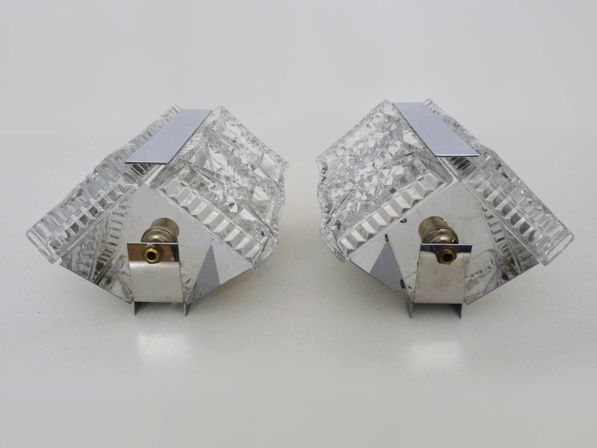 Pair of modernist 1970s glass and chrome metal wall sconces