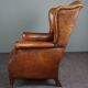 Eared armchair in patinated sheepskin