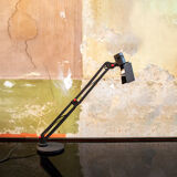 Desk lamp with metal frame and plastic details. Designer C.V.B. 80s