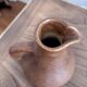 Vintage brown ceramic pitcher signed Max Idlas.