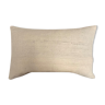 Cushion made of artisanal cotton strips.