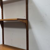 Vintage teak wall system by Poul Cadovious