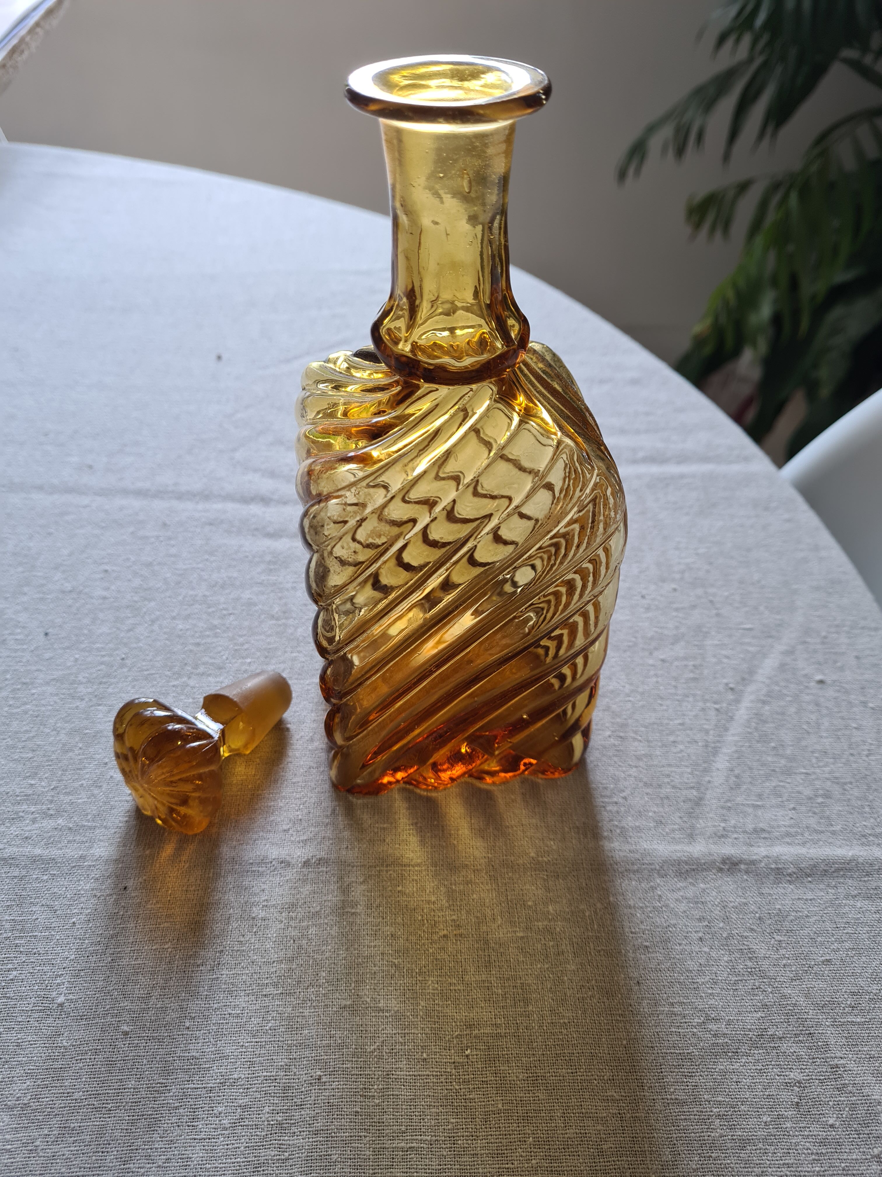 Antique decanter made of amber blown glass