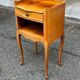 2 bedside tables in transitional or Louis XV style, made of curved solid wood with drawers.