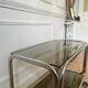 Rolling serving cart in chromed steel and smoked glass, 70s design