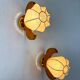 Pair of pear-shaped "Cocoon" wall sconces, resin and pine wood, Italy, circa 1970s