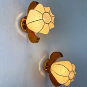 Pair of pear-shaped "Cocoon" wall sconces, resin and pine wood, Italy, circa 1970s