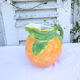 Pitcher in an orange-shaped slurry