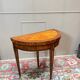 Half-moon game table in marquetry from the Louis XVI period, 18th century.