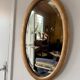 Miroir doré ovale ancien glace biseautée