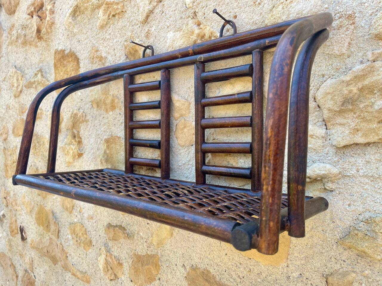 Vintage wall shelf in bamboo and rattan, circa 1960s.