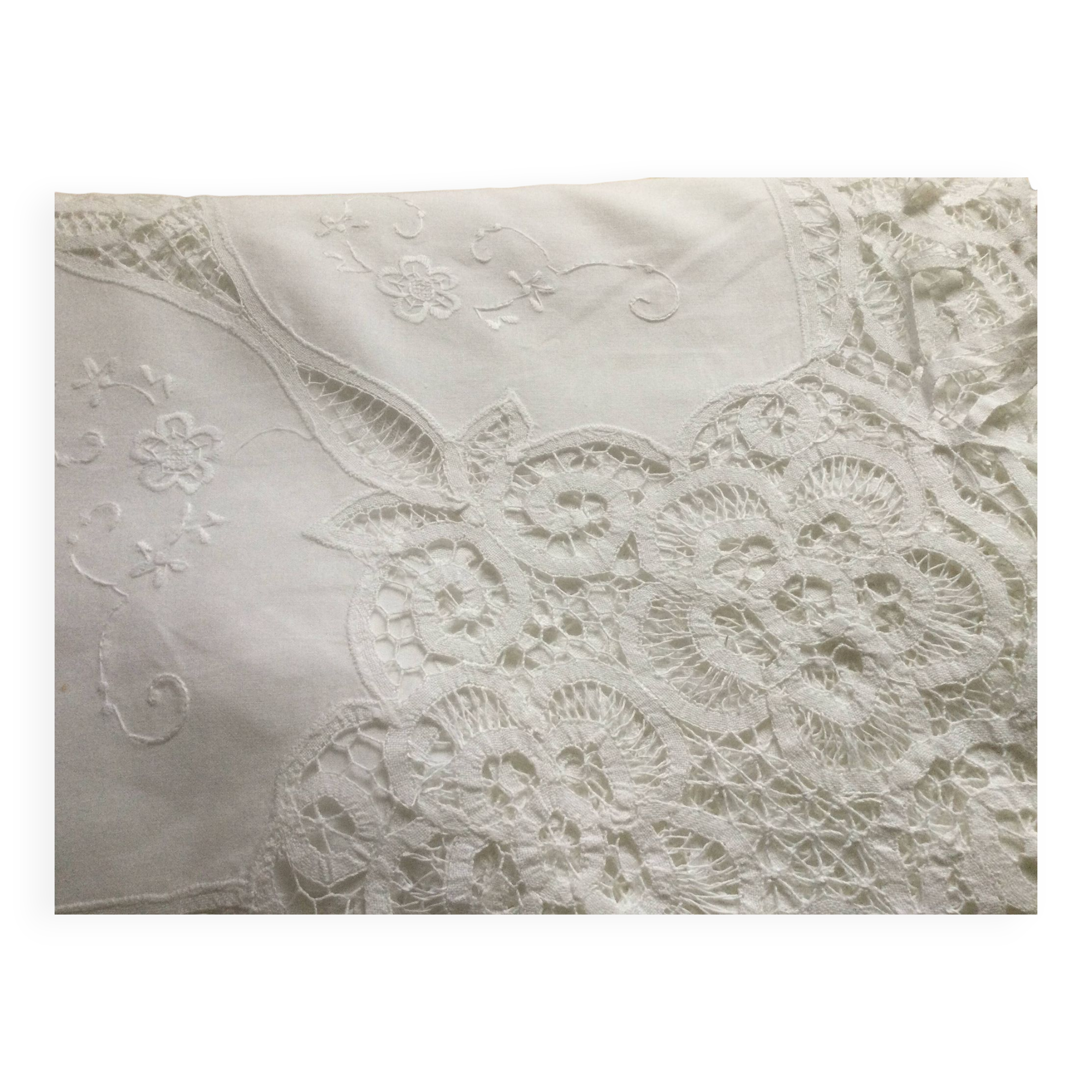 Embroidered white tablecloth and lace
