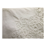 Embroidered white tablecloth and lace