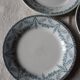 A set of 5 mismatched green blue Terre de fer flat plates